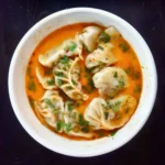 indian and chinese fusion dish jhol chicken momo at hakka fire restaurant